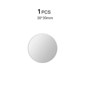 a round mirror with a white background