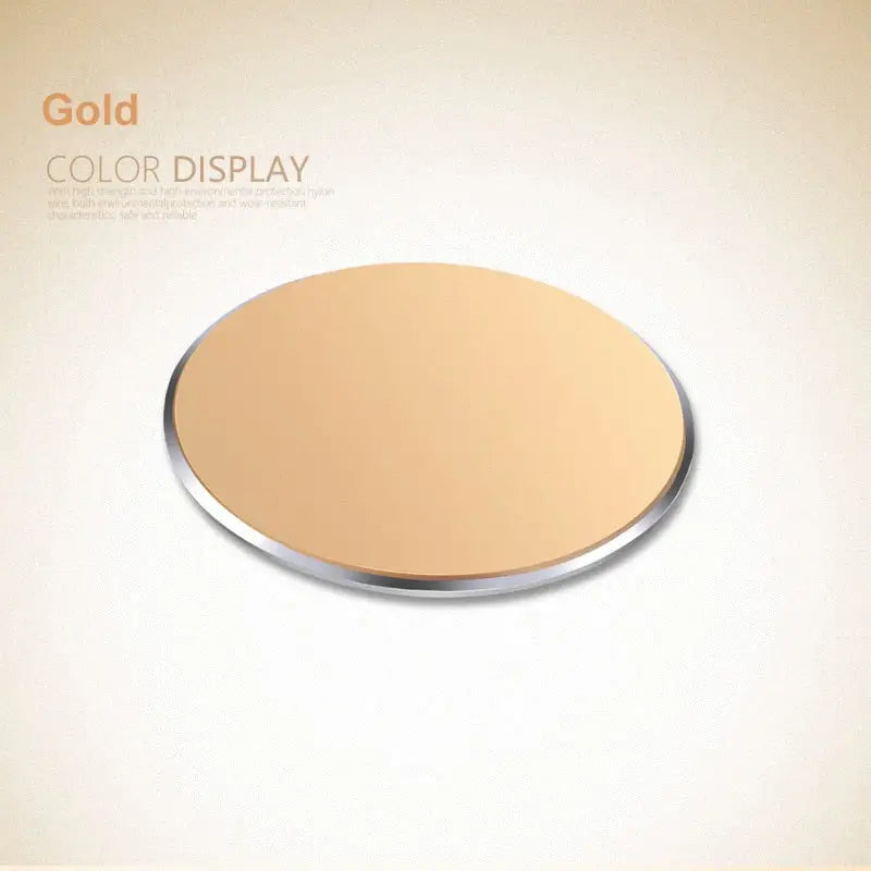 a round mirror with a gold color on a white background
