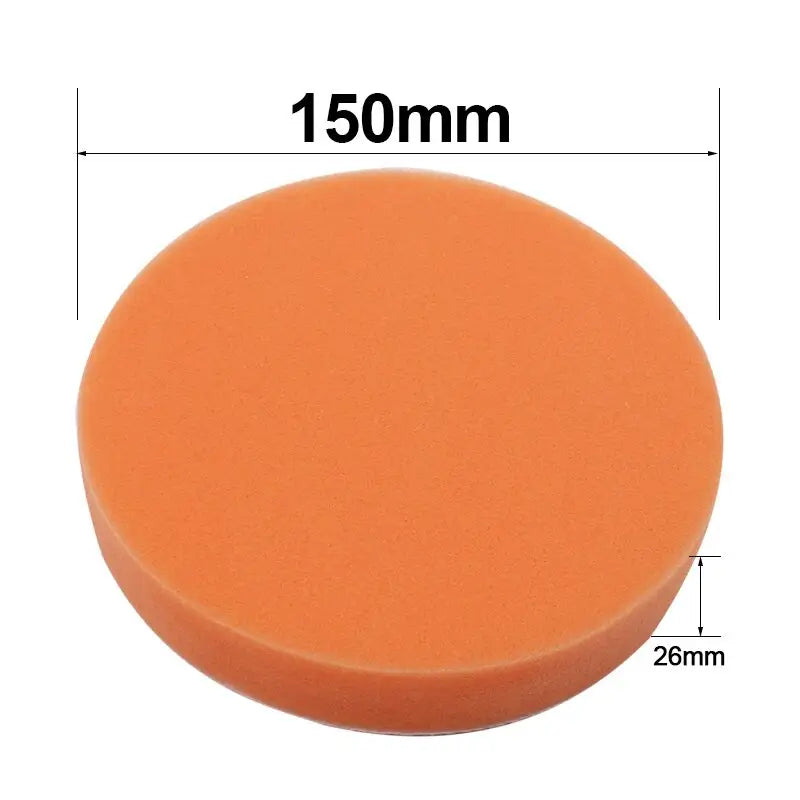 a round orange sponge with a white background