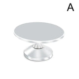 a round metal table with a white base