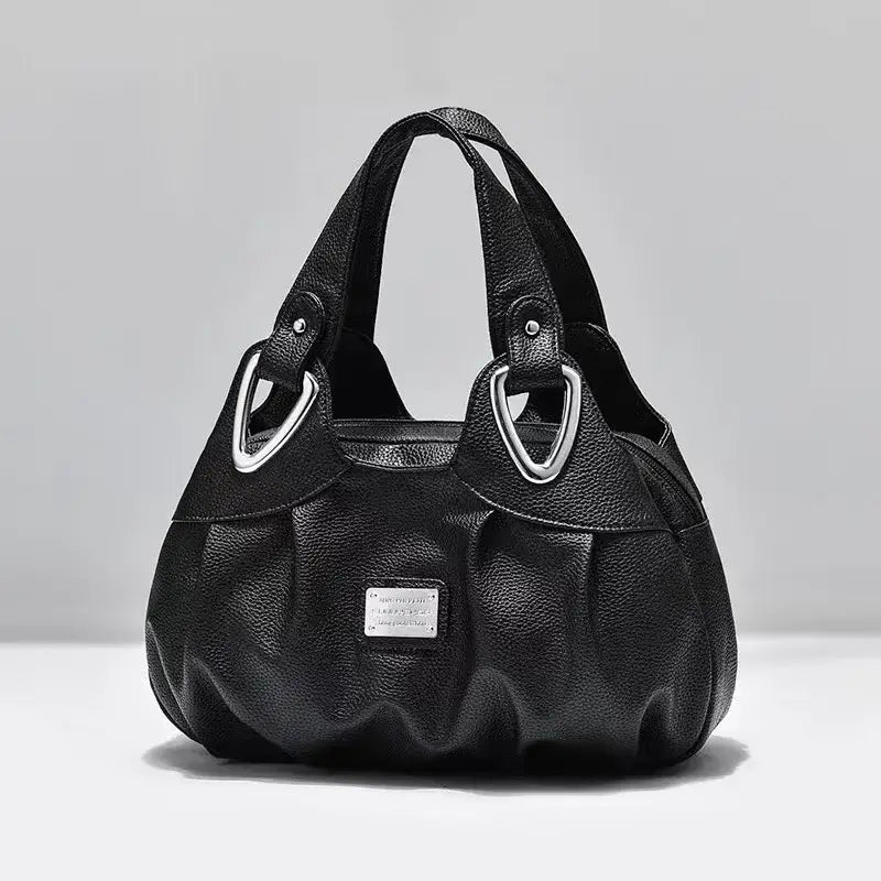 the row black textured leather shoulder bag