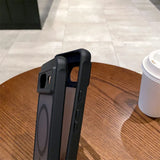 Rugged protective case for a smartphone, likely an iPhone, with a black frame and clear back panel.