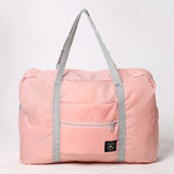 a pink duff bag with grey straps