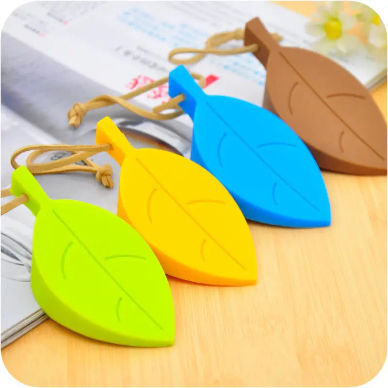 a pair of colorful plastic keychais on a wooden table