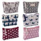 a set of four small pouch bags with different patterns