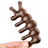 a hand holding a chocolate bar with a chocolate swirl