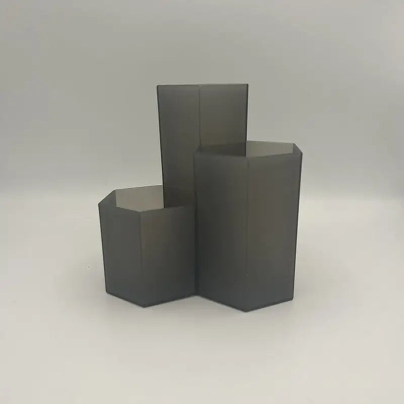 three black cubes on a white background