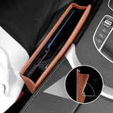 there is a car dashboard with a leather case and a cell phone