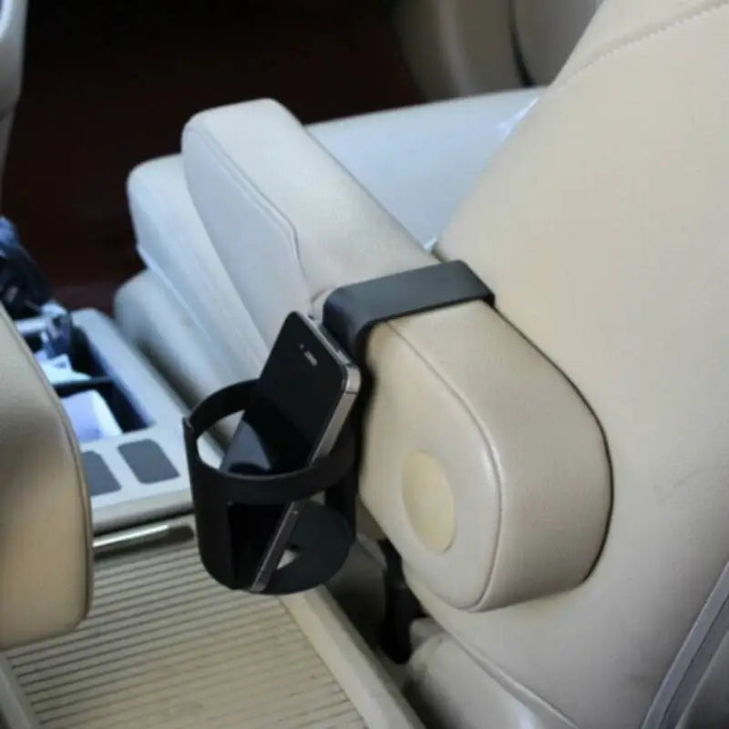 a car seat with a cup holder attached to it