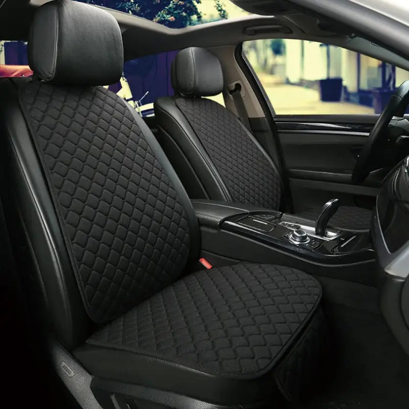 the interior of a car with black leather seats