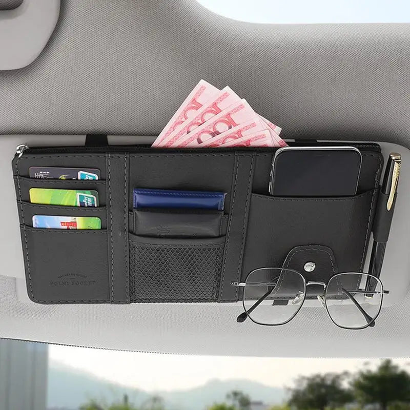 a car dashboard with a wallet and glasses