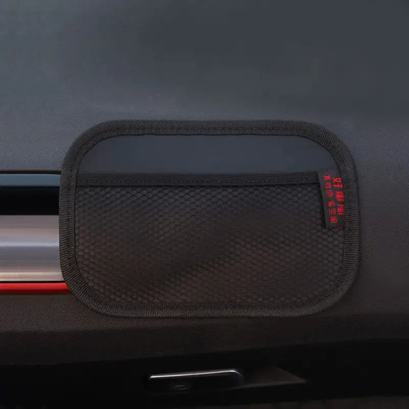 the rear seat pocket is shown with a red light on it