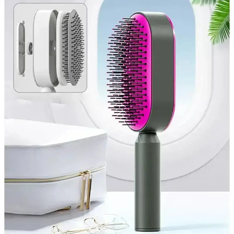 a hair brush with a pink handle