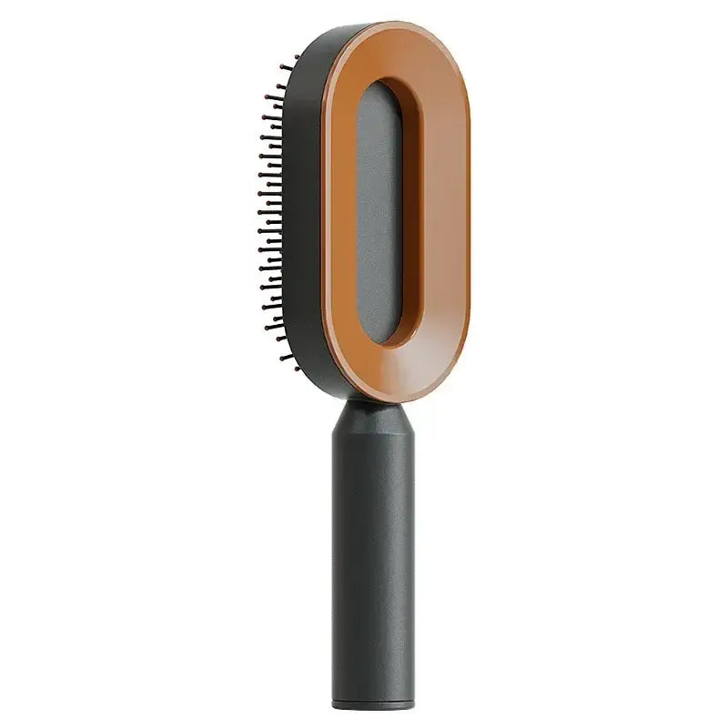 the brush is a black and brown brush with a wooden handle