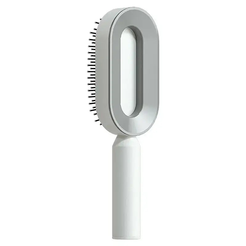 a white brush with a handle on a white background