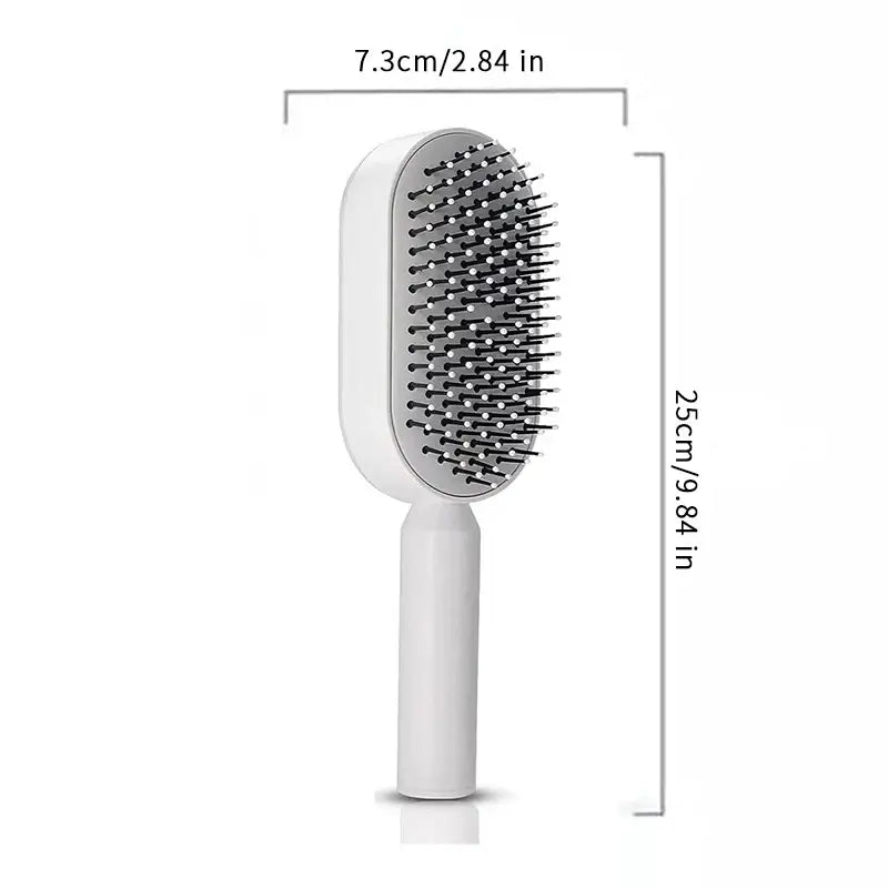 the hair brush is shown with a white handle and a black handle