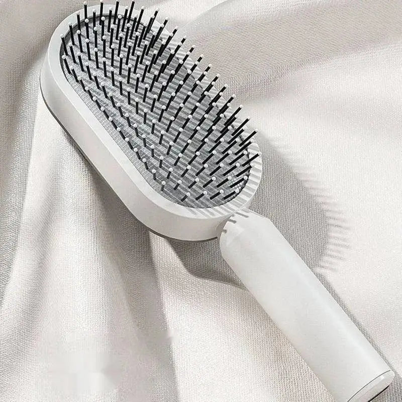 a hair brush on a white cloth