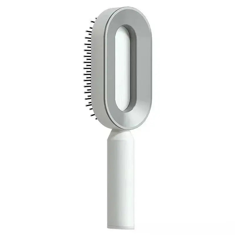 a white brush with a handle on a white background