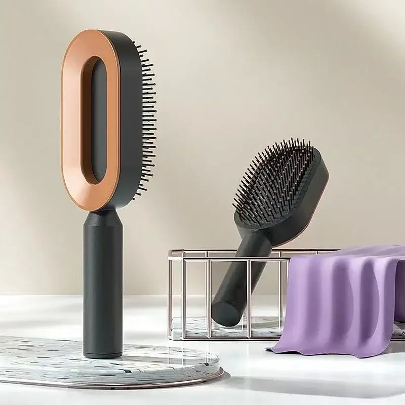 there are two hair brushes and a soap dish on a table