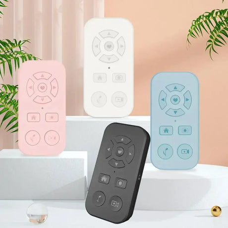 Set of colorful remote controls with minimalist designs and circular button layouts.