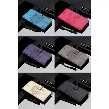 a set of four different colored leather wallets