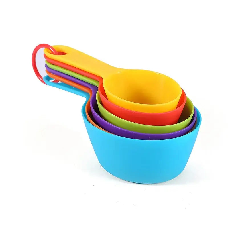 a set of four colorful plastic measuring cups