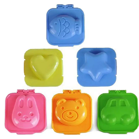 A set of four plastic pig shaped containers