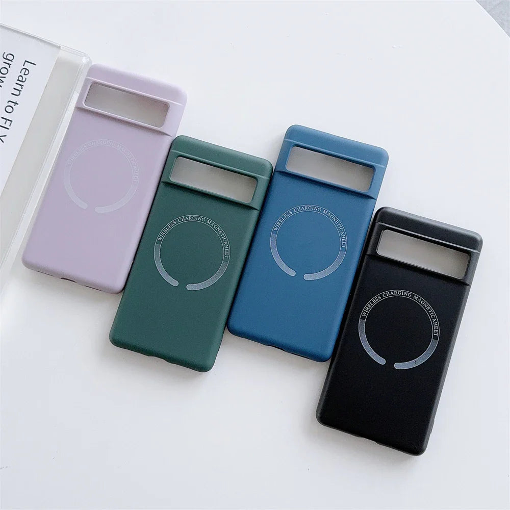 Set of four smartphone cases in different colors (lavender, green, blue, and black) with circular wireless charging indicators.