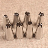 a set of four stainless cones with black and white designs