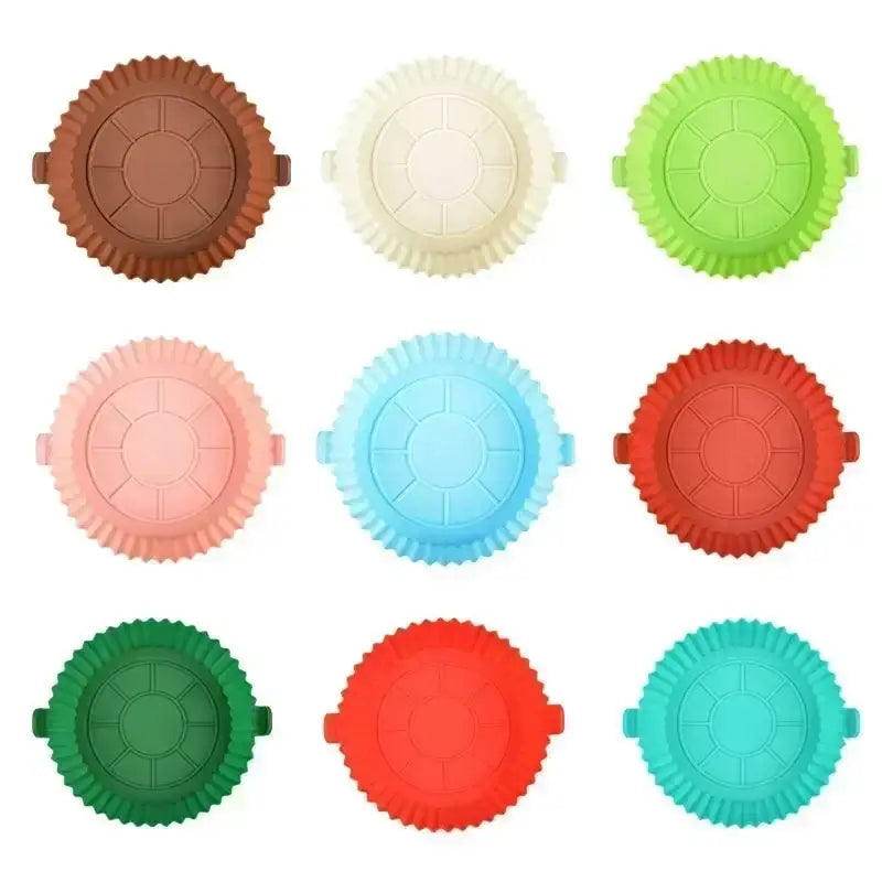 a set of six different colored cupcakes