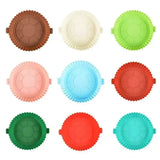 a set of six different colored cupcakes