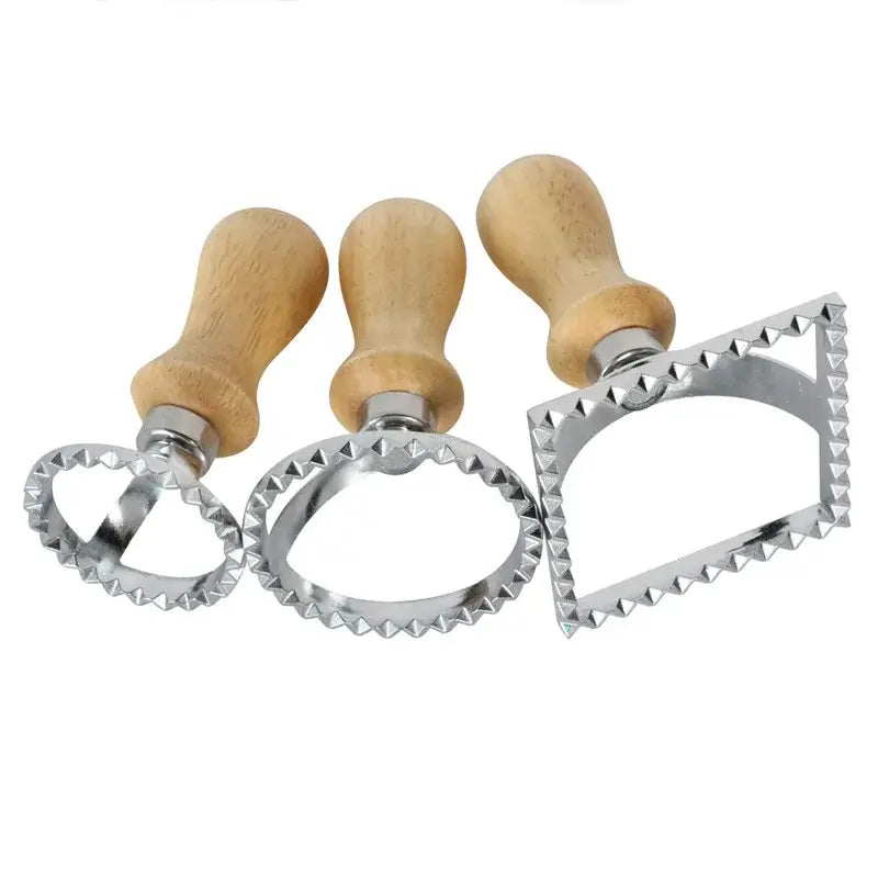 a set of three cookie cutters with wooden handles