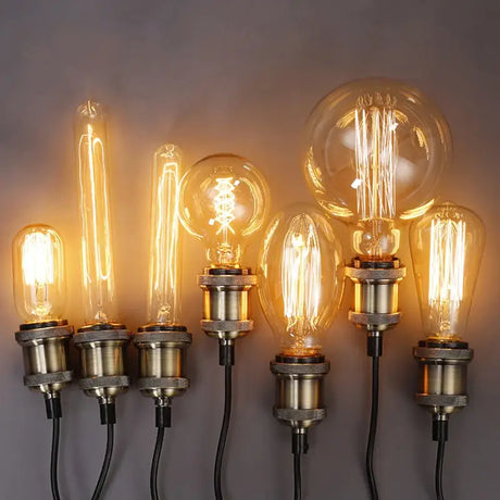 A set of three light bulbs on a wall