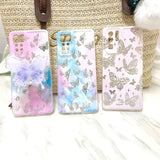 a set of three phone cases with butterflies on them