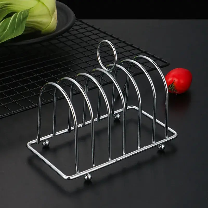 a set of three stainless steel kitchen racks