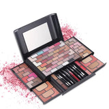 a makeup set with a palette and brush
