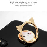a cat shaped ring with a white face
