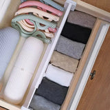 a drawer with several pairs of socks in it
