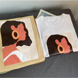 two t shirts with a woman’s face on them