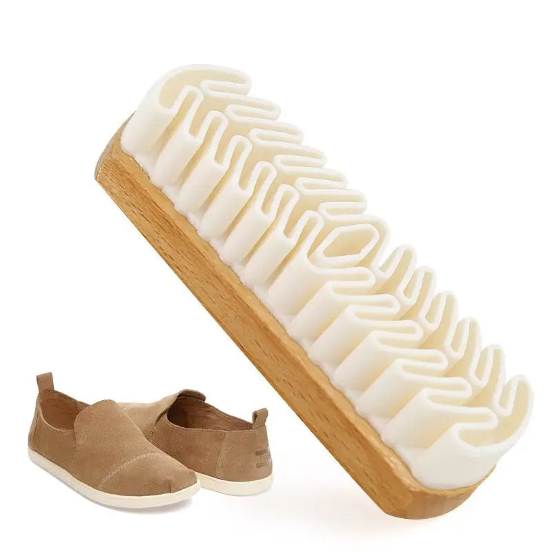 a shoe brush with a shoe on top