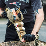 a man wearing a black shirt and black gloves