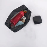 the black bag with the contents inside