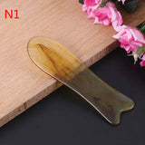 a wooden spoon with a handle on a wooden cutting board