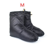 a pair of black boots with a zipper
