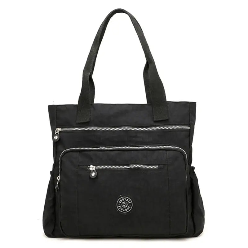 the black nylon tote bag with zippers and zipper closure