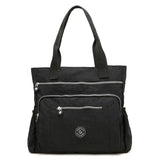 the black nylon tote bag with zippers and zipper closure