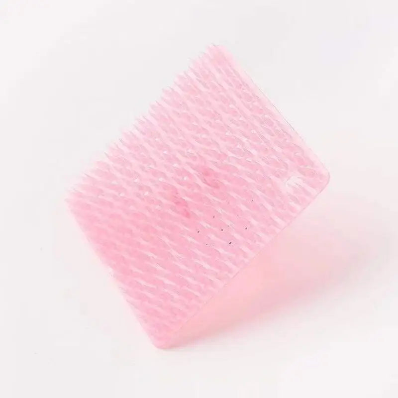 a pink brush on a white background