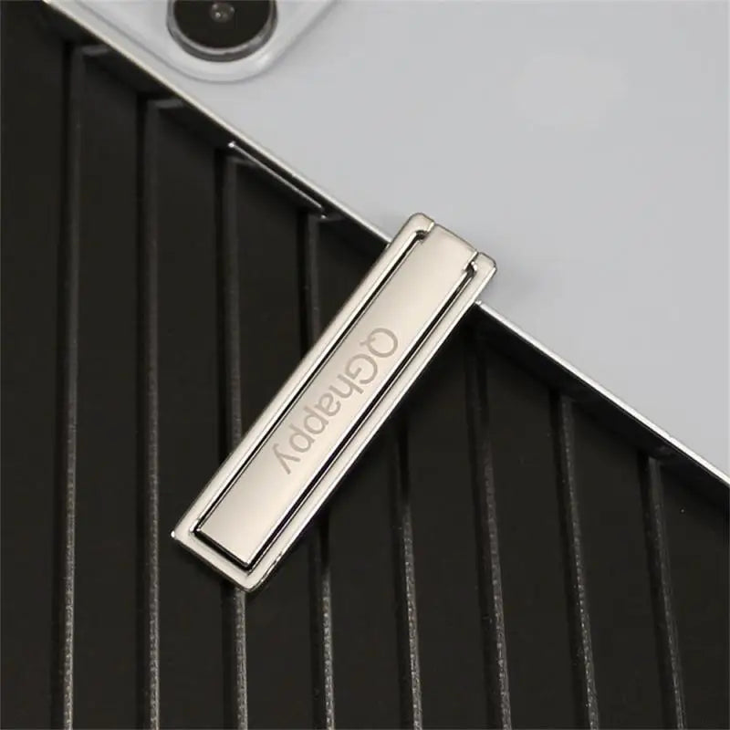 a silver metal tie bar with the word’no’on it