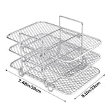 a silver metal wire basket with a white background