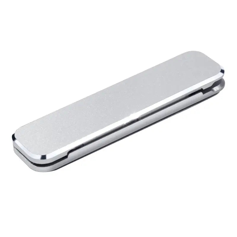 a silver money clip on a white background